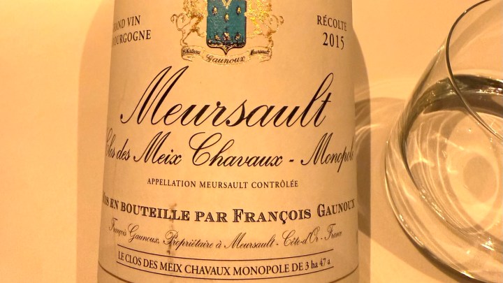A close-up of a wine bottle label for Meursault Clos des Meix Chavaux - Monpoul, vintage 2015, produced by François Gaunoux, featuring the Appellation Meursault Contrôlée.