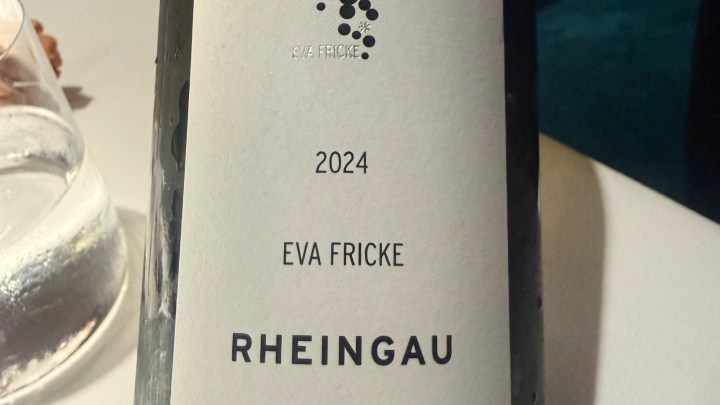 A close-up of a wine bottle label, featuring the text '2024 EVA FRICKE RHEINGAU' on a white background, with a design element at the top.