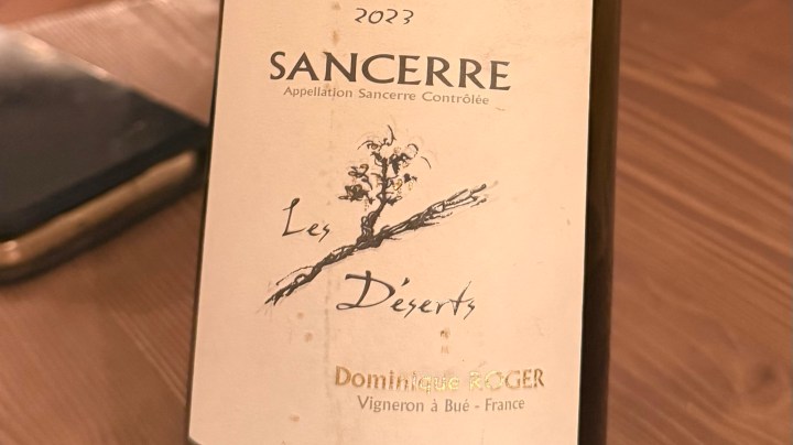 Close-up of a wine bottle label featuring 'Sancerre 2023' from Domaine Roger with the text 'Les Déserts' and the phrase 'Appellation Sancerre Contrôlée'.
