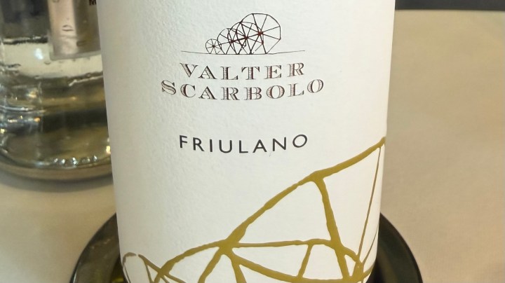 Bottle of Valter Scarbolo Friulano wine with a minimalist white label and gold geometric design.